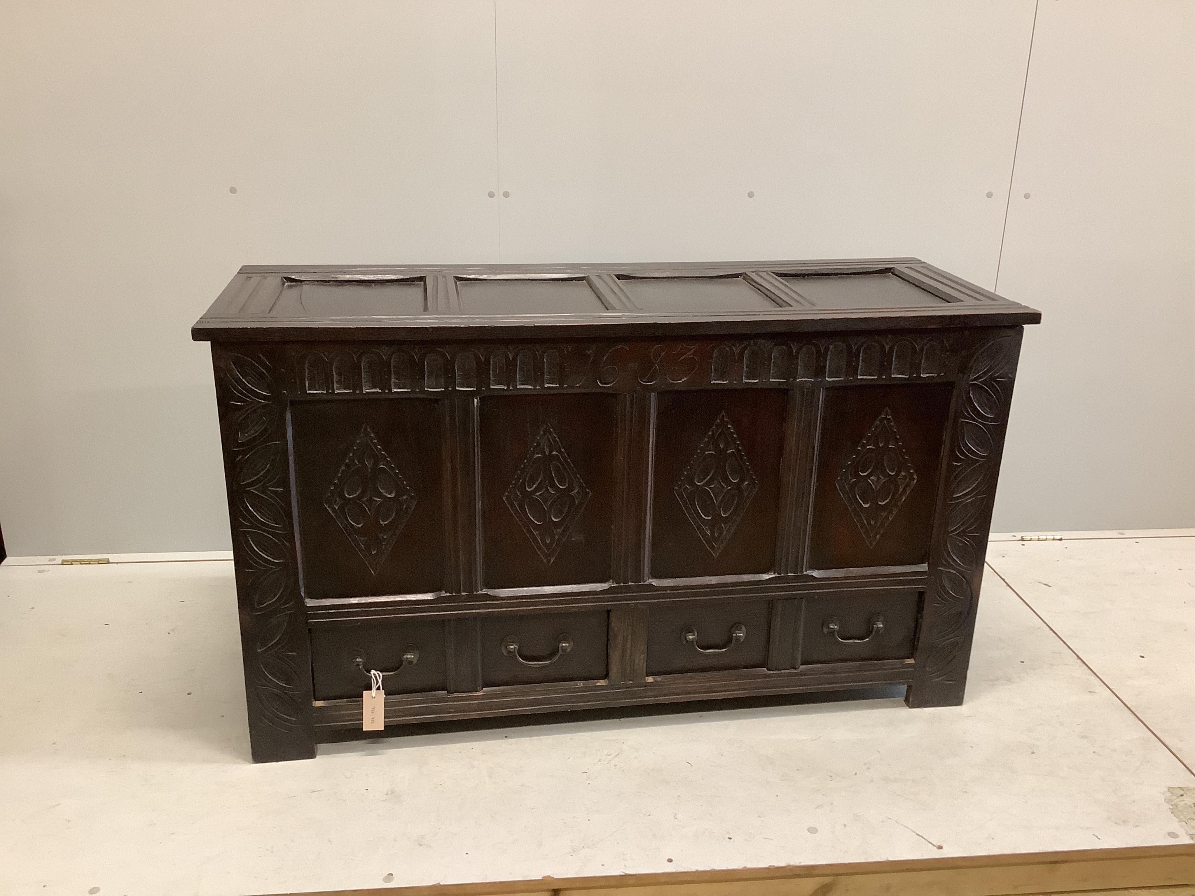 A carved oak mule chest bearing date 1683, width 139cm, depth 51cm, height 79cm. Condition - fair to good